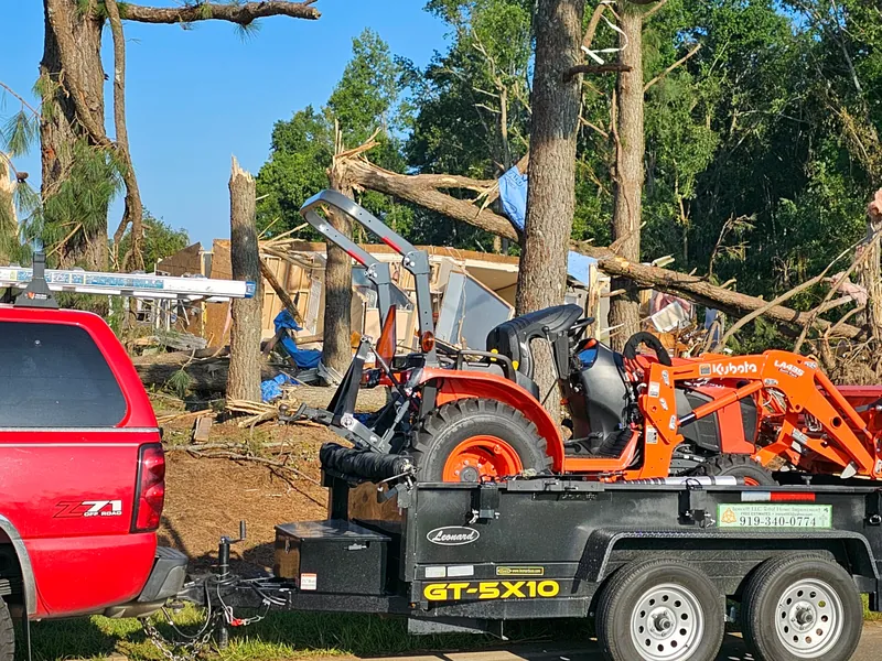 Tractor clearing storm debris